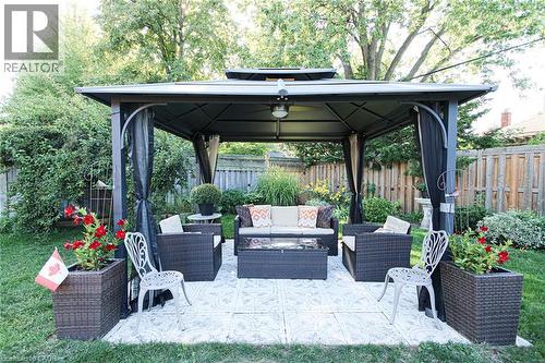 Manicured lawn with a privacy fence - 2105 Maplewood Drive, Burlington, ON - Outdoor With Deck Patio Veranda