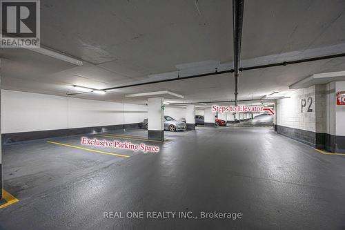 214 - 111 Upper Duke Crescent, Markham, ON - Indoor Photo Showing Garage