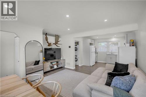 Bright living area featuring wood-finish flooring and recessed lighting - 450 Highland Road E, Kitchener, ON - Indoor Photo Showing Living Room