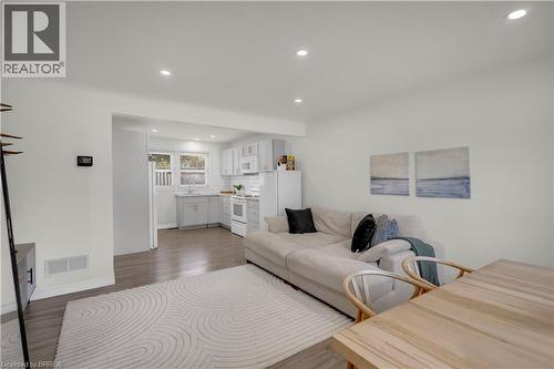 Open-concept living area with wood-finish flooring, recessed lighting, and a bright white paint scheme - 450 Highland Road E, Kitchener, ON - Indoor Photo Showing Living Room