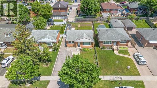 Brick bungalow residence with a gabled roofline and front porch - 450 Highland Road E, Kitchener, ON - Outdoor