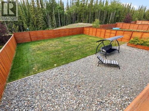 26 Iskoot Crescent, Whitehorse, YT - Outdoor With Backyard