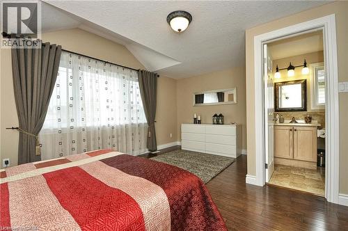 Wood-finish flooring throughout, vaulted ceiling, and recessed window with ample natural light - 156 Copper Leaf Street, Kitchener, ON - Indoor Photo Showing Bedroom