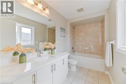Double vanity with integrated sinks and white cabinetry - 24 Weatherall Avenue, Cambridge, ON - Indoor Photo Showing Bathroom