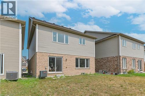 Brick and siding exterior with multiple windows and a sliding glass door - 24 Weatherall Avenue, Cambridge, ON - Outdoor With Exterior