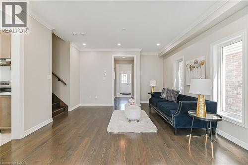 Hardwood flooring, recessed lighting, crown molding, and multiple windows - 24 Weatherall Avenue, Cambridge, ON - Indoor Photo Showing Living Room