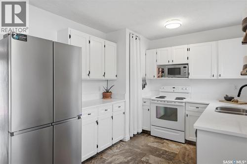 58 120 Acadia Drive, Saskatoon, SK - Indoor Photo Showing Kitchen With Double Sink