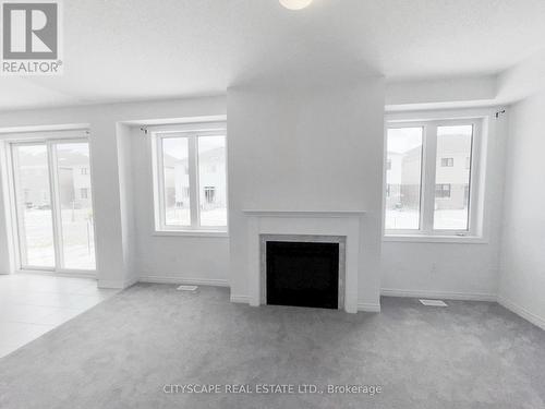 Family Room - 259 Rea Drive, Centre Wellington, ON - Indoor With Fireplace