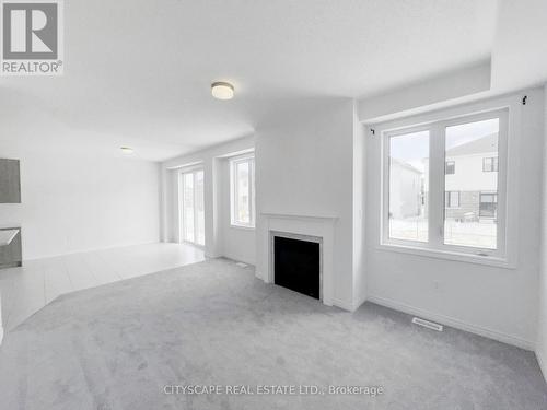 Family Room - 259 Rea Drive, Centre Wellington, ON - Indoor With Fireplace