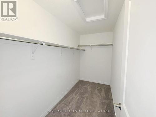Primary Bedroom Walk-In-Closet - 259 Rea Drive, Centre Wellington, ON - Indoor With Storage