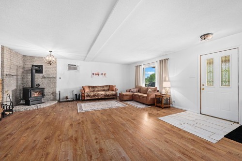 Salon - 997C Route 303 N., Clarendon, QC - Indoor Photo Showing Living Room With Fireplace