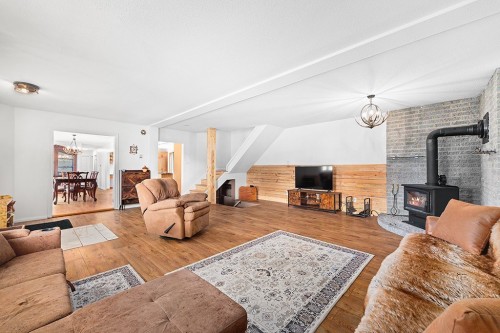 Salon - 997C Route 303 N., Clarendon, QC - Indoor Photo Showing Living Room With Fireplace