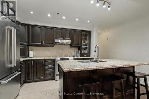 318 - 1440 Gordon Street, Guelph (Pineridge/Westminster Woods), ON - Indoor Photo Showing Kitchen With Stainless Steel Kitchen With Double Sink With Upgraded Kitchen