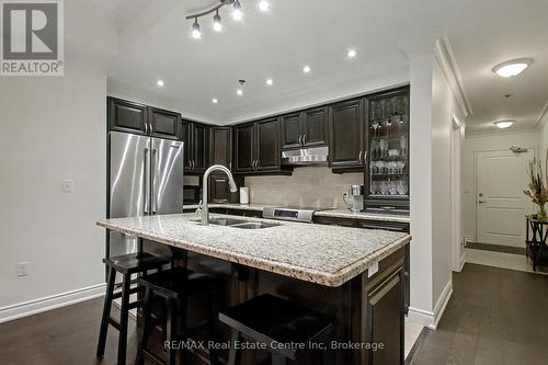 318 - 1440 Gordon Street, Guelph (Pineridge/Westminster Woods), ON - Indoor Photo Showing Kitchen With Stainless Steel Kitchen With Double Sink With Upgraded Kitchen