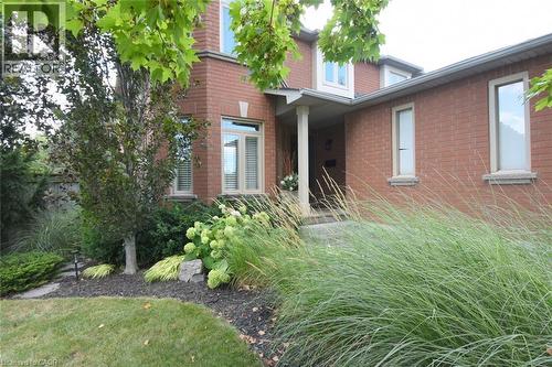 Meticulously landscaping surrounds front walkway entrance - 470 Amanda Crescent, Burlington, ON - Outdoor