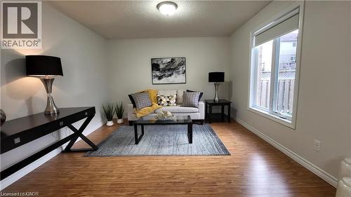 Wood-finish flooring throughout - 128 Udvari Crescent Unit# A, Kitchener, ON - Indoor Photo Showing Other Room