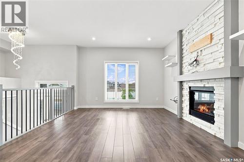 134 Bolstad Way, Saskatoon, SK - Indoor Photo Showing Other Room With Fireplace