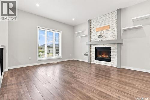 134 Bolstad Way, Saskatoon, SK - Indoor Photo Showing Living Room With Fireplace