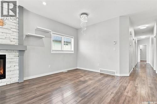 134 Bolstad Way, Saskatoon, SK - Indoor Photo Showing Other Room With Fireplace