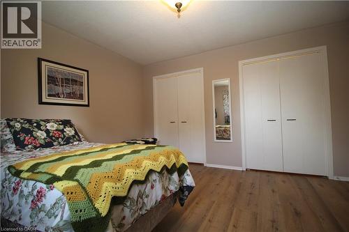 Laminate flooring with neutral wall tones - 14 Berkley Crescent, Simcoe, ON - Indoor Photo Showing Bedroom