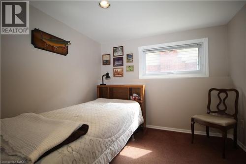 Recessed ceiling lighting, a single window with white trim, light-toned wall paint, and brown carpeting - 14 Berkley Crescent, Simcoe, ON - Indoor Photo Showing Bedroom