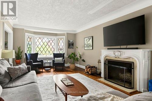 71 Stanley Avenue, Hamilton, ON - Indoor Photo Showing Living Room With Fireplace