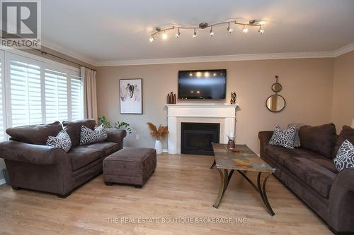Family room and fireplace - 470 Amanda Crescent, Burlington, ON - Indoor Photo Showing Living Room With Fireplace