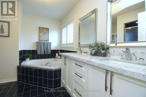 ensuite soaker tub and stone counter - 470 Amanda Crescent, Burlington, ON - Indoor Photo Showing Bathroom