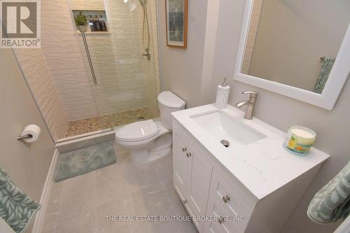 Lower level stone sink and glass enclosed shower - 470 Amanda Crescent, Burlington, ON - Indoor Photo Showing Bathroom