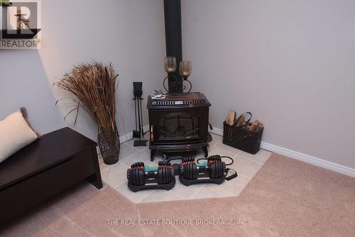Lower level fireplace - 470 Amanda Crescent, Burlington, ON - Indoor Photo Showing Other Room