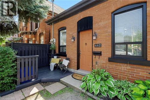 Brick exterior with black trim windows - 442 King William Street, Hamilton, ON 