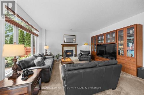 40 Bon Echo Crescent, Ottawa, ON - Indoor Photo Showing Living Room With Fireplace
