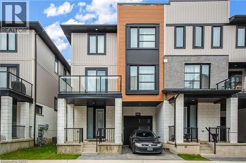 Modern exterior featuring a combination of brick, horizontal siding, and vertical paneling - 961 Battery Park, London, ON - Outdoor With Balcony With Facade