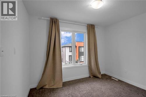 White walls with brown carpeting and a single window - 961 Battery Park, London, ON - Indoor