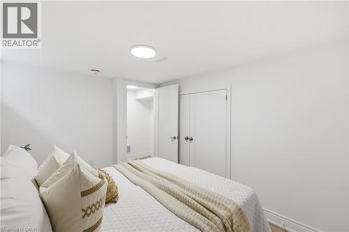 Recessed lighting, white walls, and built-in closet with double doors - 156 East 36Th Street, Hamilton, ON - Indoor Photo Showing Bedroom