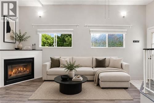 Virtually Staged - 24 Hill Street, Hamilton, ON - Indoor Photo Showing Living Room With Fireplace