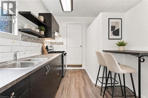 Virtually Staged - 24 Hill Street, Hamilton, ON - Indoor Photo Showing Kitchen With Double Sink