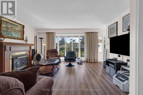 61 Bernick Drive, Barrie, ON - Indoor Photo Showing Living Room With Fireplace
