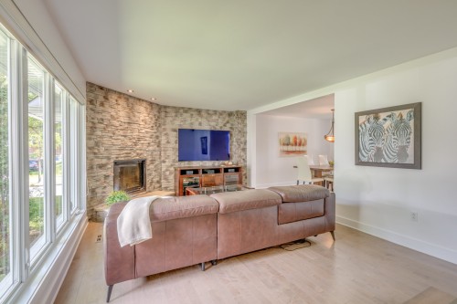 Living Room - 1 Place De Chazelles, Lorraine, QC - Indoor Photo Showing Living Room With Fireplace