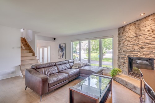Living Room - 1 Place De Chazelles, Lorraine, QC - Indoor Photo Showing Living Room With Fireplace