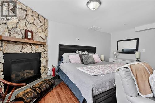 Part of Rec Room used as a bedroom - 11 Rochelle Crescent, Ridgeway, ON - Indoor Photo Showing Bedroom With Fireplace