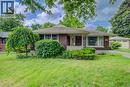 Brick exterior with a covered porch, established shrubbery, and a mature weeping tree in the front yard - 244 Royal Street, Waterloo, ON  - Outdoor 