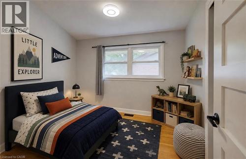 Hardwood flooring, recessed lighting, and a white paneled door - 244 Royal Street, Waterloo, ON - Indoor Photo Showing Bedroom