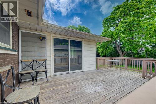 Expansive wood deck with wood railings, sliding glass door access, and an exterior light fixture - 244 Royal Street, Waterloo, ON - Outdoor With Deck Patio Veranda With Exterior