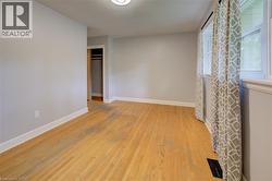 Light-toned wood flooring, neutral wall tones, and white trim - 
