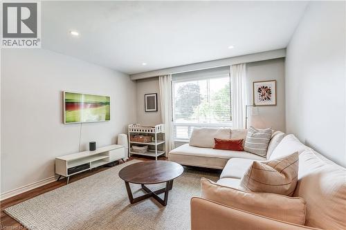 Recessed lighting, wood-finish flooring, and large windows with blinds - 2488 Brookhurst Road, Mississauga, ON - Indoor Photo Showing Living Room