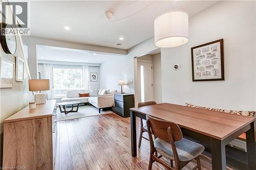 Wood-finish flooring, recessed lighting, and a drum pendant light fixture - 2488 Brookhurst Road, Mississauga, ON - Indoor Photo Showing Dining Room