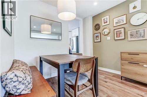 Wood-finish flooring with crisp white baseboards - 2488 Brookhurst Road, Mississauga, ON - Indoor