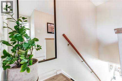 Hardwood handrail on white walls - 2488 Brookhurst Road, Mississauga, ON - Indoor Photo Showing Other Room
