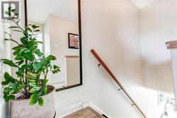 Hardwood handrail on white walls - 